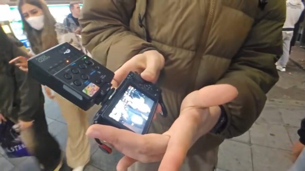 The Canadian photographer showing Hazu and hyubsama the picture he took of them