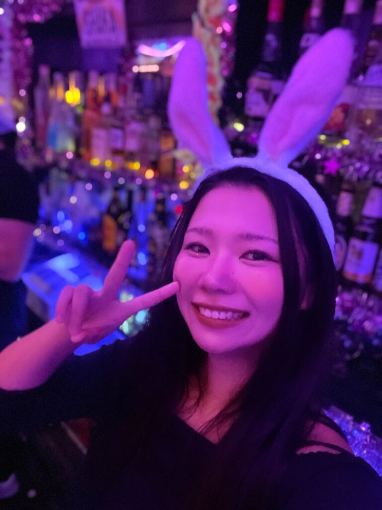 Hazunats dressed like a bunny at the bar she works at.