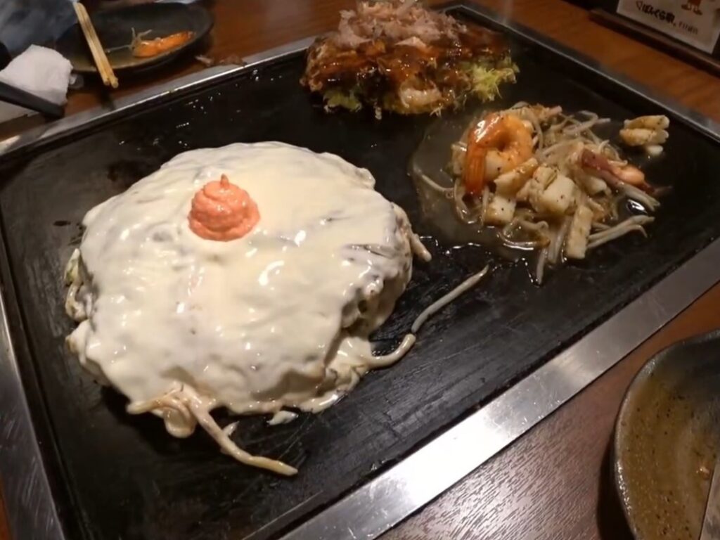 A huge okonomiyaki topped with mayo to look like a huge tit from Okonomiyaki Bonkuraya.