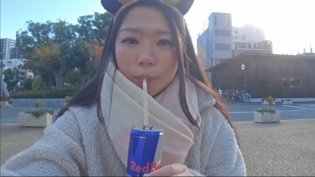 Hazu drinking her signature sugar-free red bull.