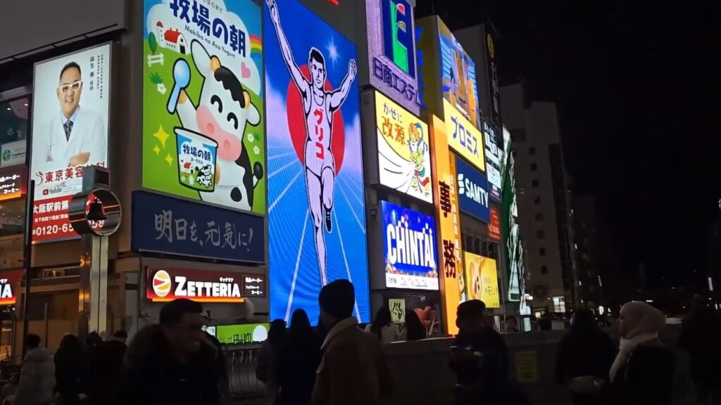 A sign of the iconic Dotonbori Glico man.